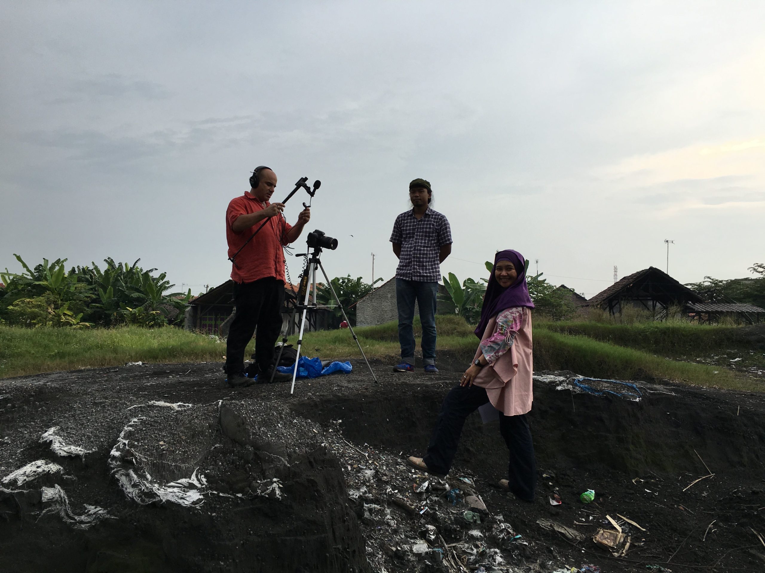 Budi, Pure Earth's country director in Indonesia, preparing for an interview in the middle of the dumpsite.
