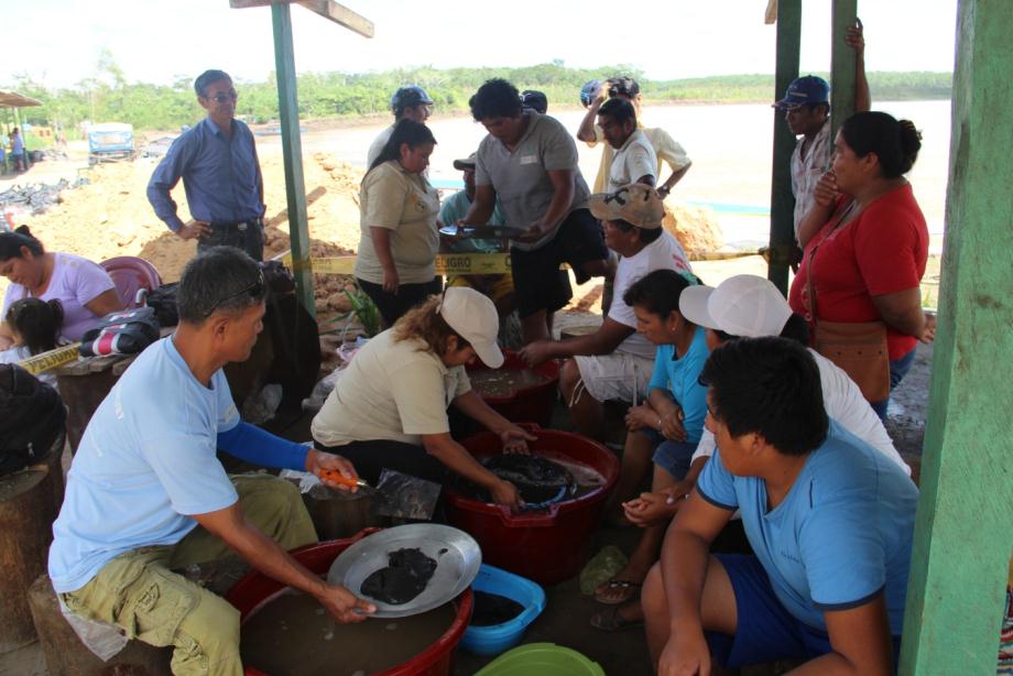 Gold miners at a training session learning how to go mercury free.