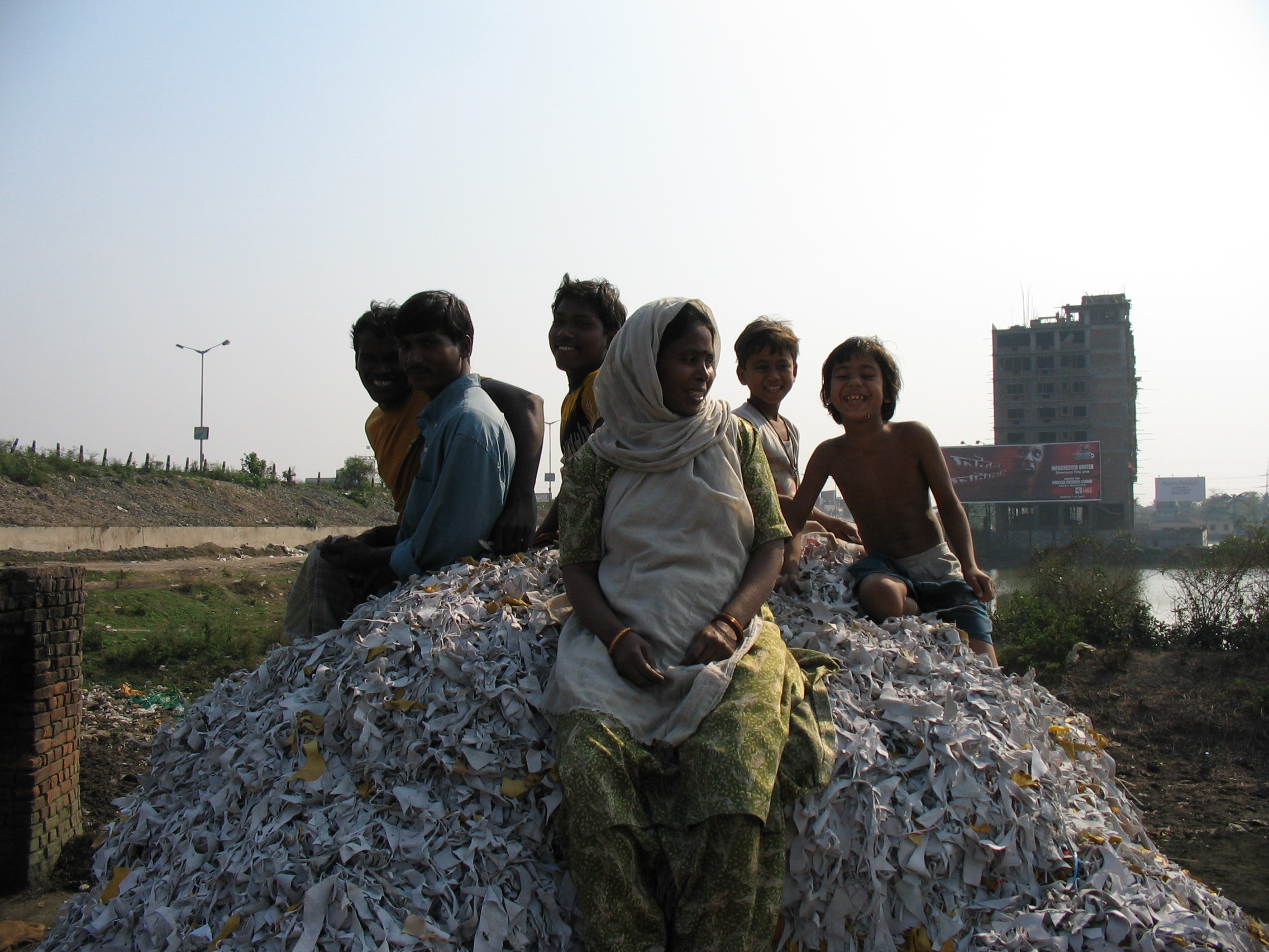 Taking a break from scavenging at a dumpsite in India