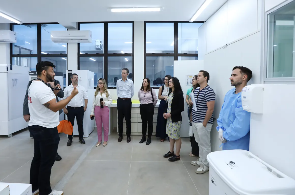 An official walks Pure Earth and government partners through a public health laboratory in Brazil